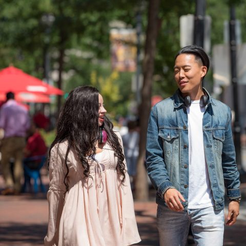 couple walking on market street near Wilmington, DE apartments